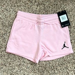 New with tags size youth small, pink Nike Jordan shorts